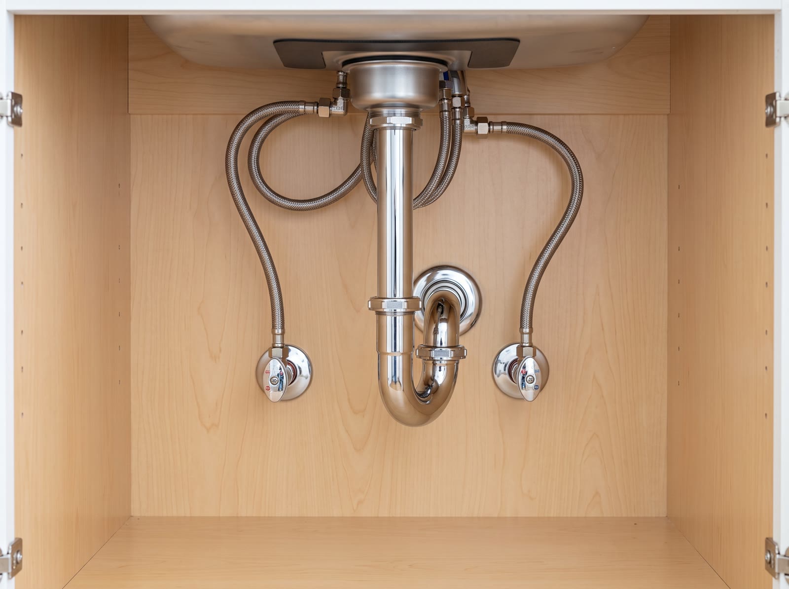 Clean under-sink kitchen plumbing